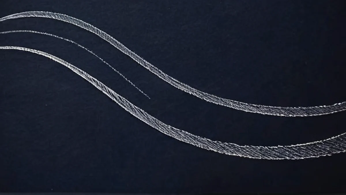 Smooth wave lines drawn in white chalk across a dark navy card.